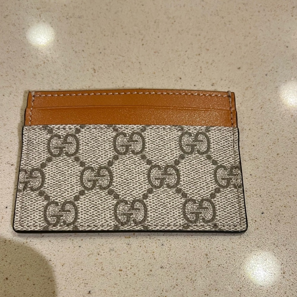 Gucci supreme monogram canvas with brown card holder
NWOT, COA included